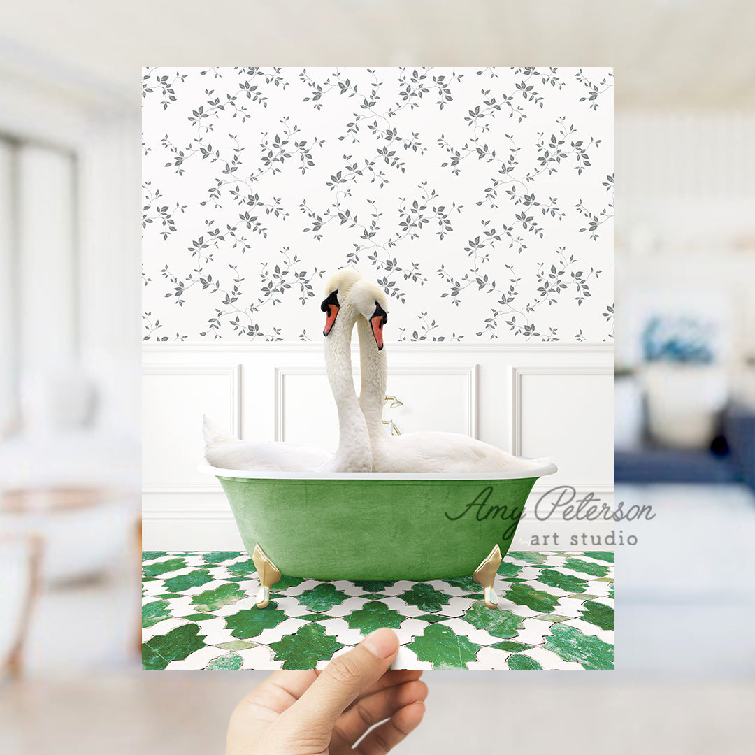 a person holding up a card with a picture of a swan in a bathtub