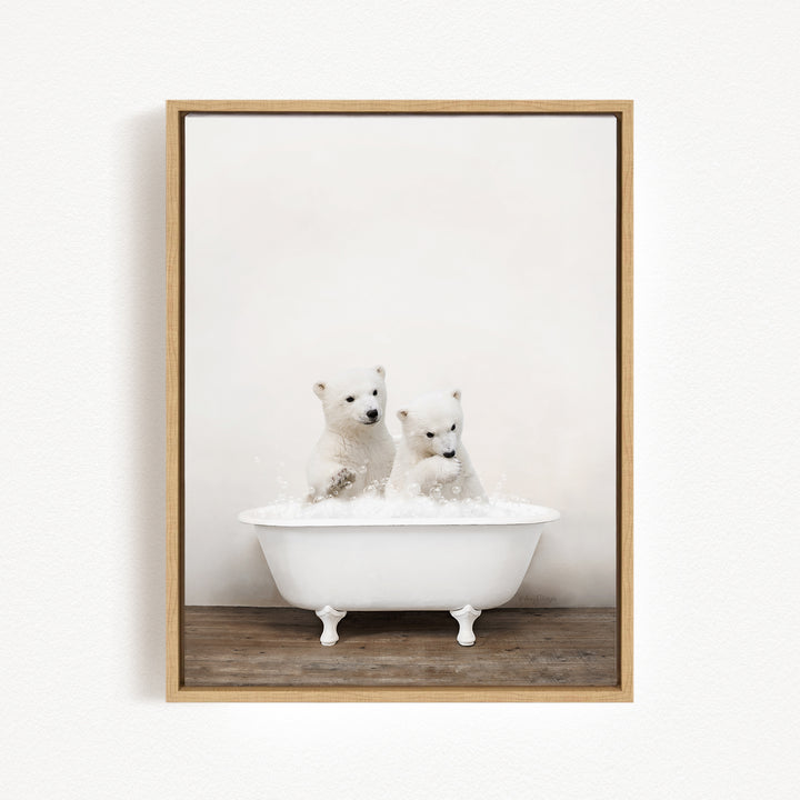Two adorable polar bear cubs sitting in a white bathtub filled with bubbles, enjoying a playful bath together.