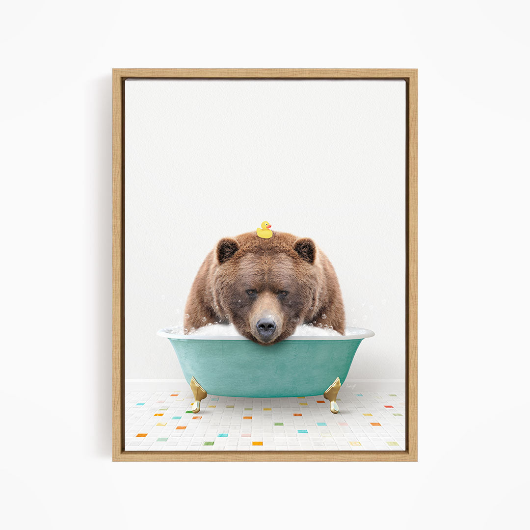 A brown bear is sitting in a blue tub filled with water, with a yellow rubber duck floating on its head.