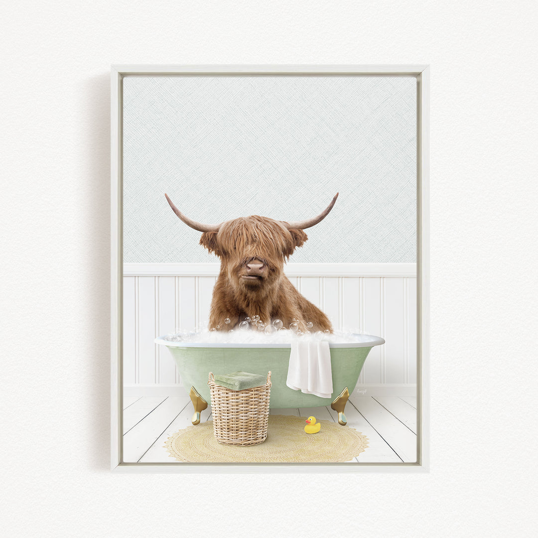 A Highland cow with long horns is sitting in a green bathtub filled with bubbles, surrounded by rubber ducks and a basket.