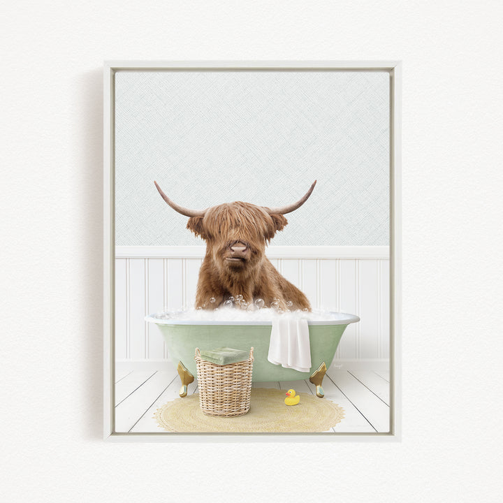 A Highland cow with long horns is sitting in a green bathtub filled with bubbles, surrounded by rubber ducks and a basket.