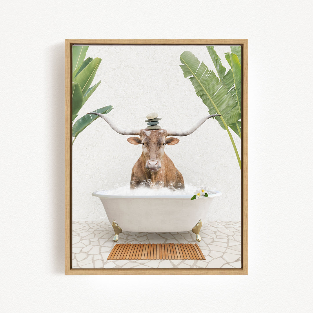 A cow with large horns is sitting in a white bathtub filled with water, surrounded by tropical plants and a wooden mat on the floor.
