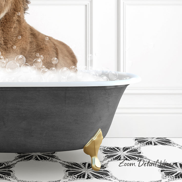A dog is standing in a bathtub filled with bubbles, with a gold bathtub leg visible.