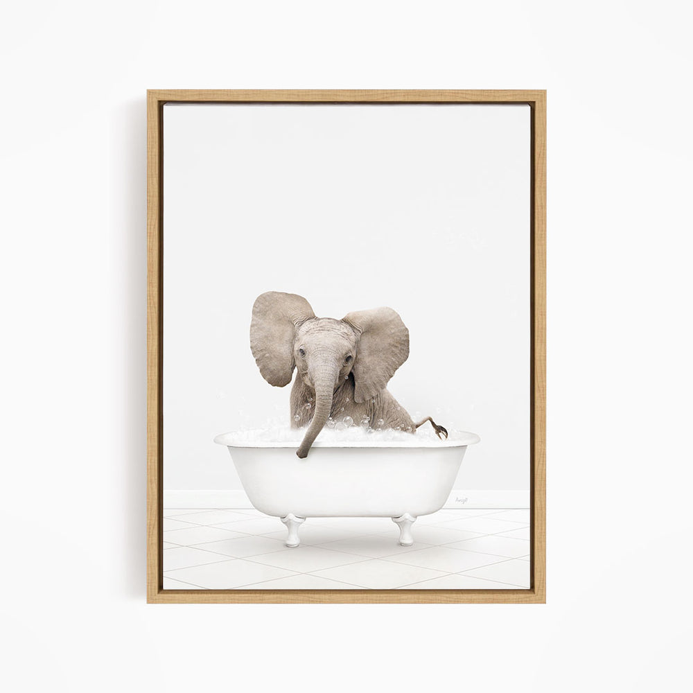 A baby elephant sitting in a white bathtub filled with water, with its trunk submerged in the water.