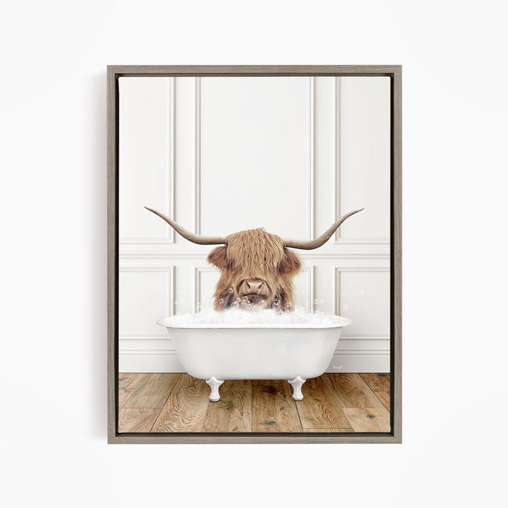 A Highland cow with long horns is sitting in a white bathtub, appearing to enjoy the bath.