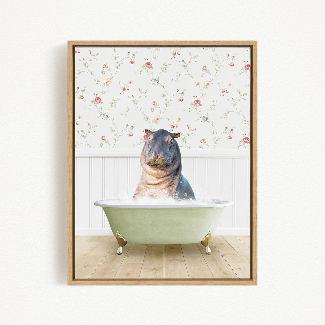 A hippopotamus sitting in a green bathtub filled with water, surrounded by a floral patterned wall.