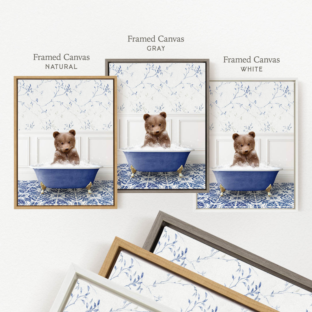 a framed canvas with a brown bear sitting in a blue bathtub, surrounded by a floral pattern.