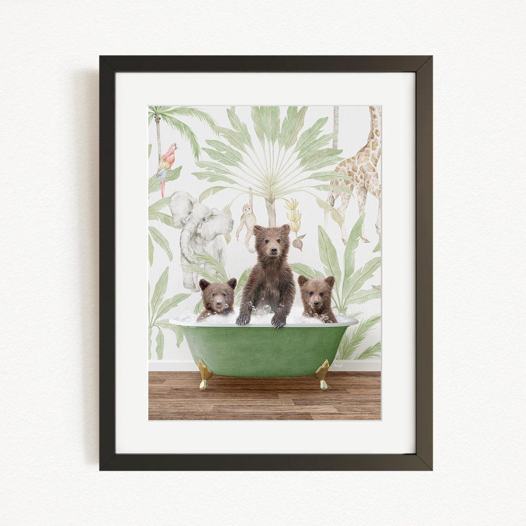 A framed print depicting three bears sitting in a green bathtub, surrounded by a tropical jungle wallpaper.