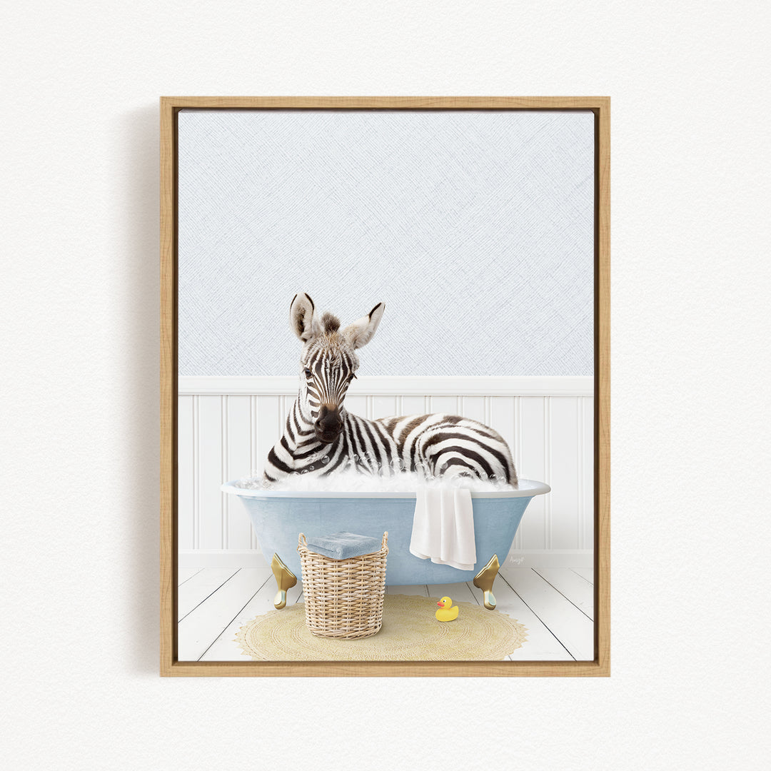 A zebra is sitting in a blue bathtub, surrounded by rubber ducks and a basket.