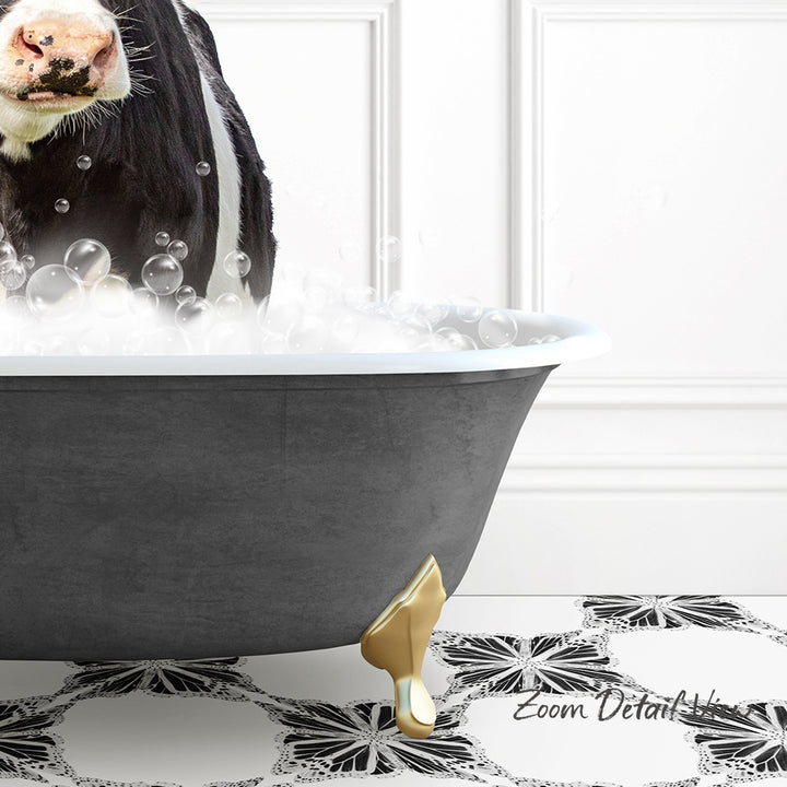 A black and white cow standing in a bathtub filled with bubbles, with a gold bathtub leg visible.