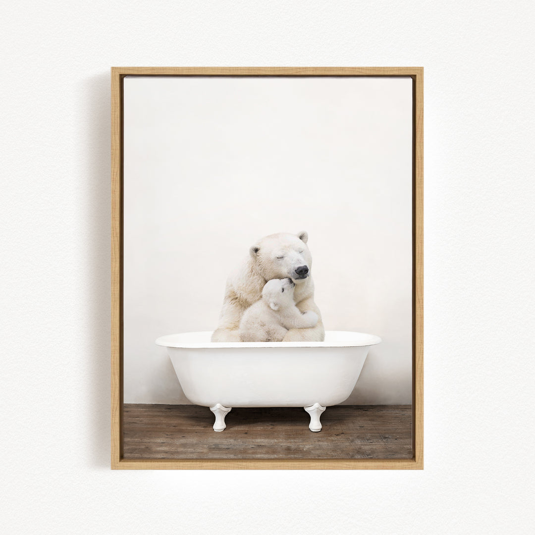 A mother polar bear and her cub sitting together in a white bathtub, with the mother appearing to be comforting her cub.