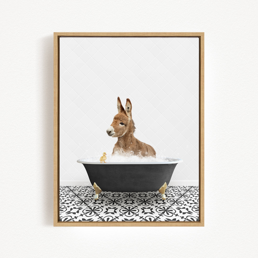 A donkey is sitting in a bathtub filled with water, surrounded by a few small ducks.