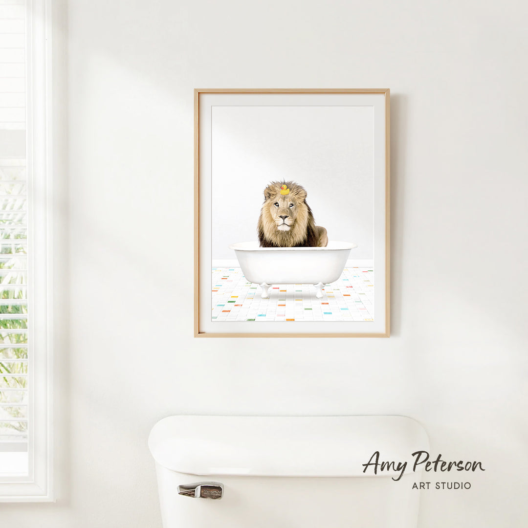 A framed image of a lion sitting in a bathtub, with a colorful patterned floor below.