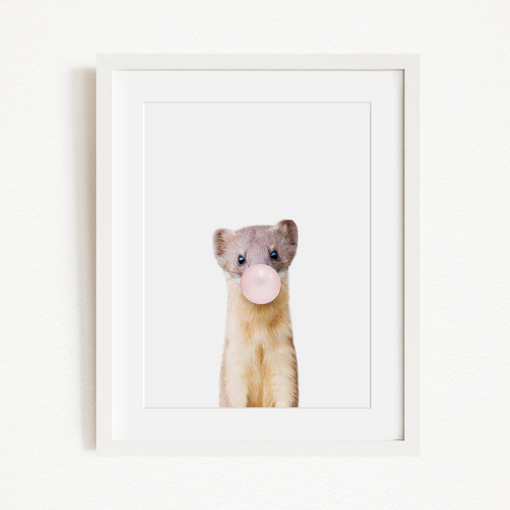 A small animal, possibly a rodent or a similar creature, is blowing a bubble with a pink bubble gum bubble wand.