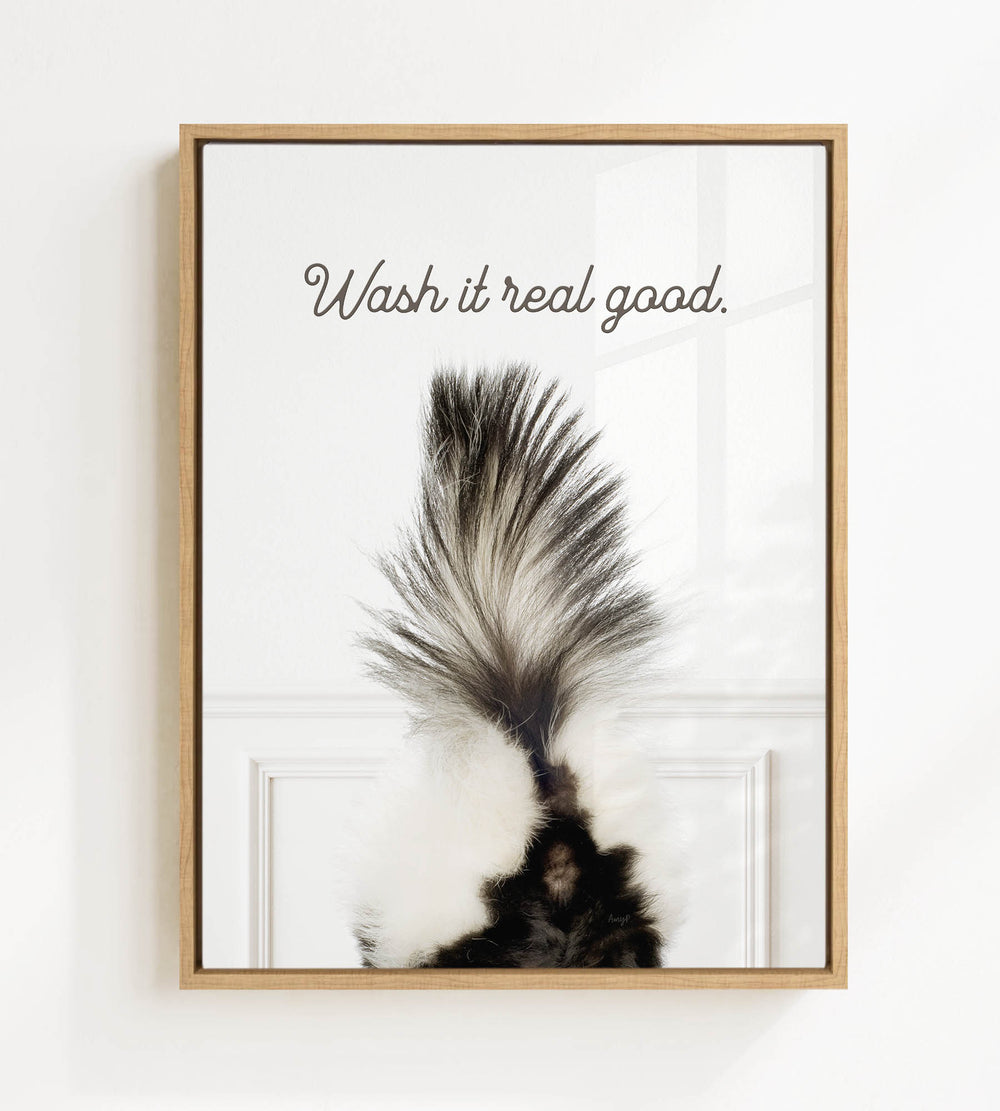 a close-up of a skunk's tail with the text "Wash it real good."