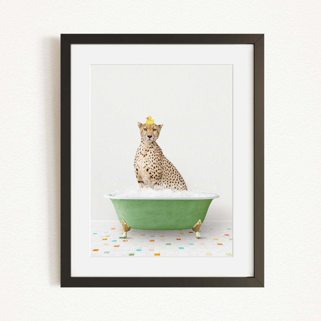 A cheetah sitting in a green bathtub filled with water, wearing a yellow hat.
