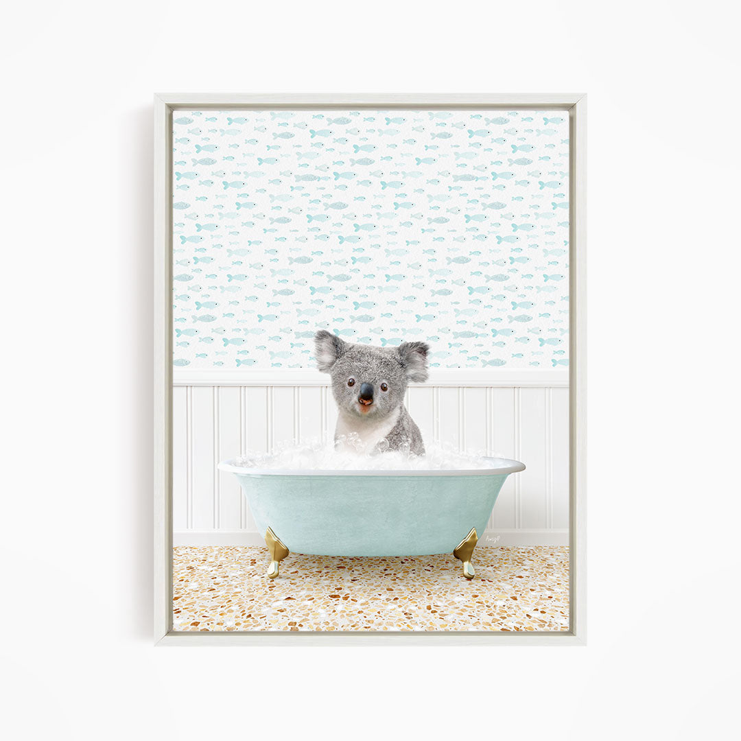 A koala bear sitting in a bathtub filled with water, surrounded by a pattern of fish.