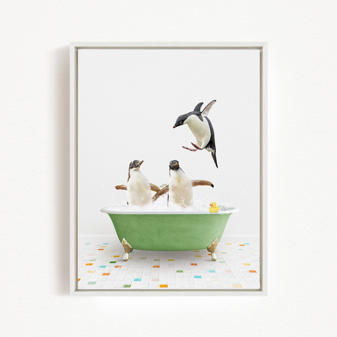 A framed image depicting two penguins sitting in a green bathtub, with one penguin jumping out of the tub and another penguin sitting in the tub.