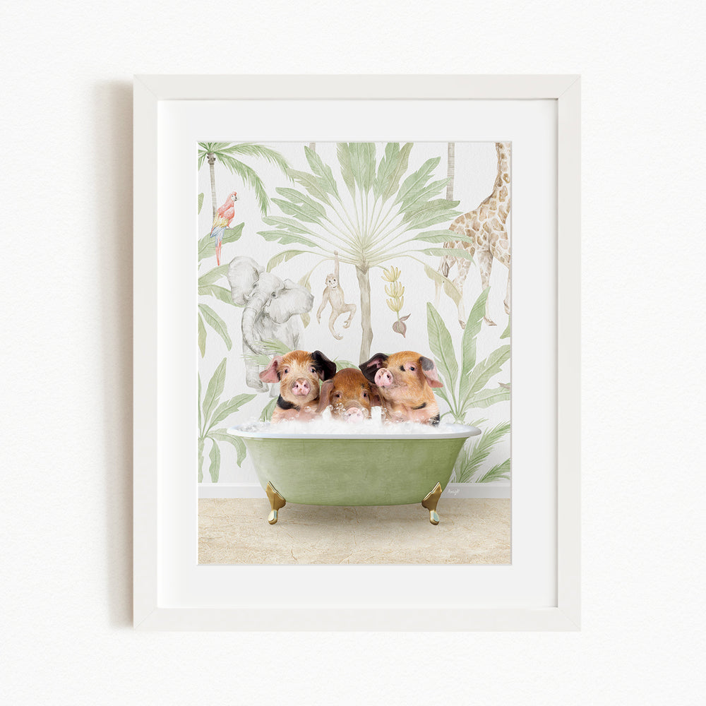 A framed print depicting three pigs sitting in a green bathtub, surrounded by a tropical jungle wallpaper with various animals and plants.