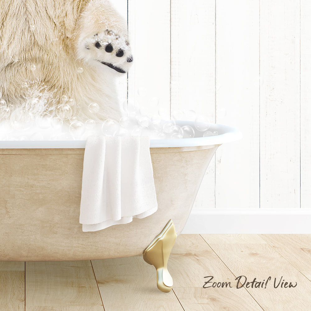 A polar bear is standing in a bathtub filled with bubbles, with a towel and gold claw-like objects nearby.
