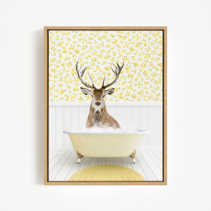 A deer with antlers is sitting in a bathtub filled with bubbles, surrounded by a yellow floral pattern on the wall behind it.
