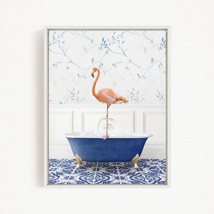 A pink flamingo standing on the edge of a blue bathtub, with a patterned tile floor and a floral wallpaper in the background.