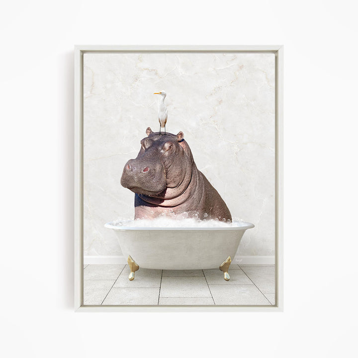 A large hippopotamus is sitting in a white bathtub, with a white bird perched on its head.