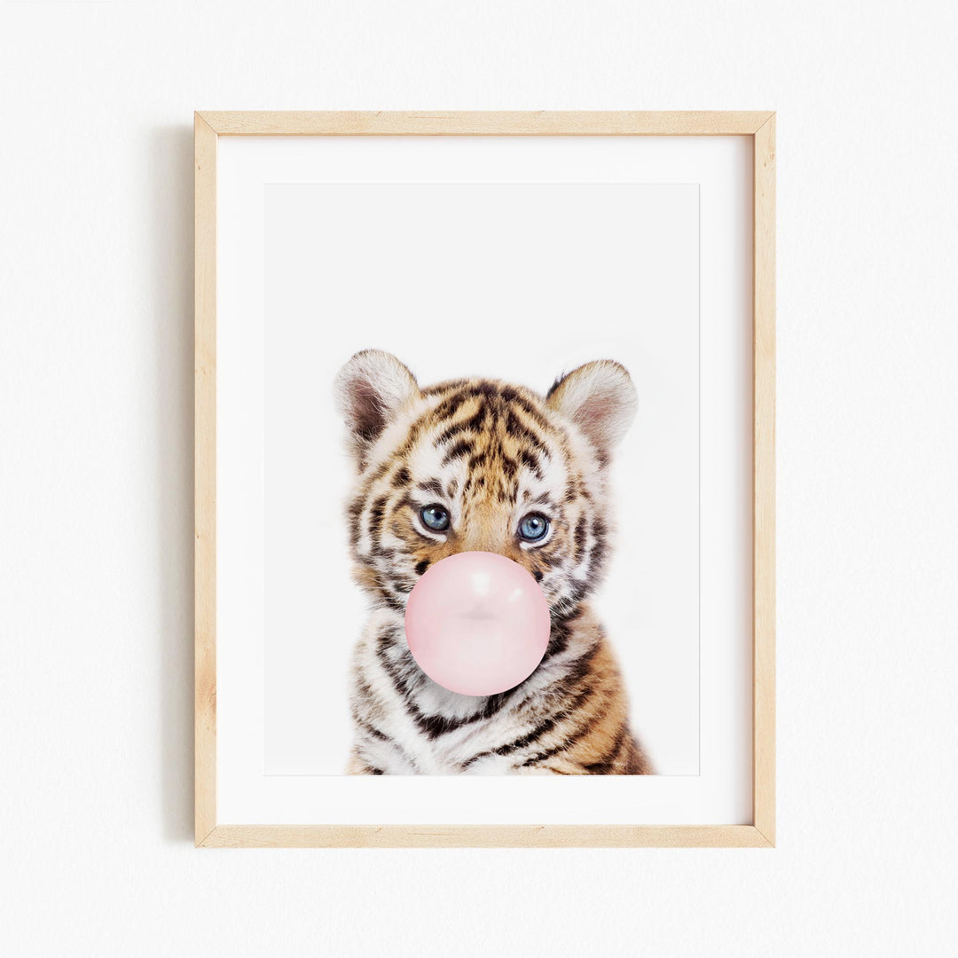 a picture of a baby tiger with a bubble gum