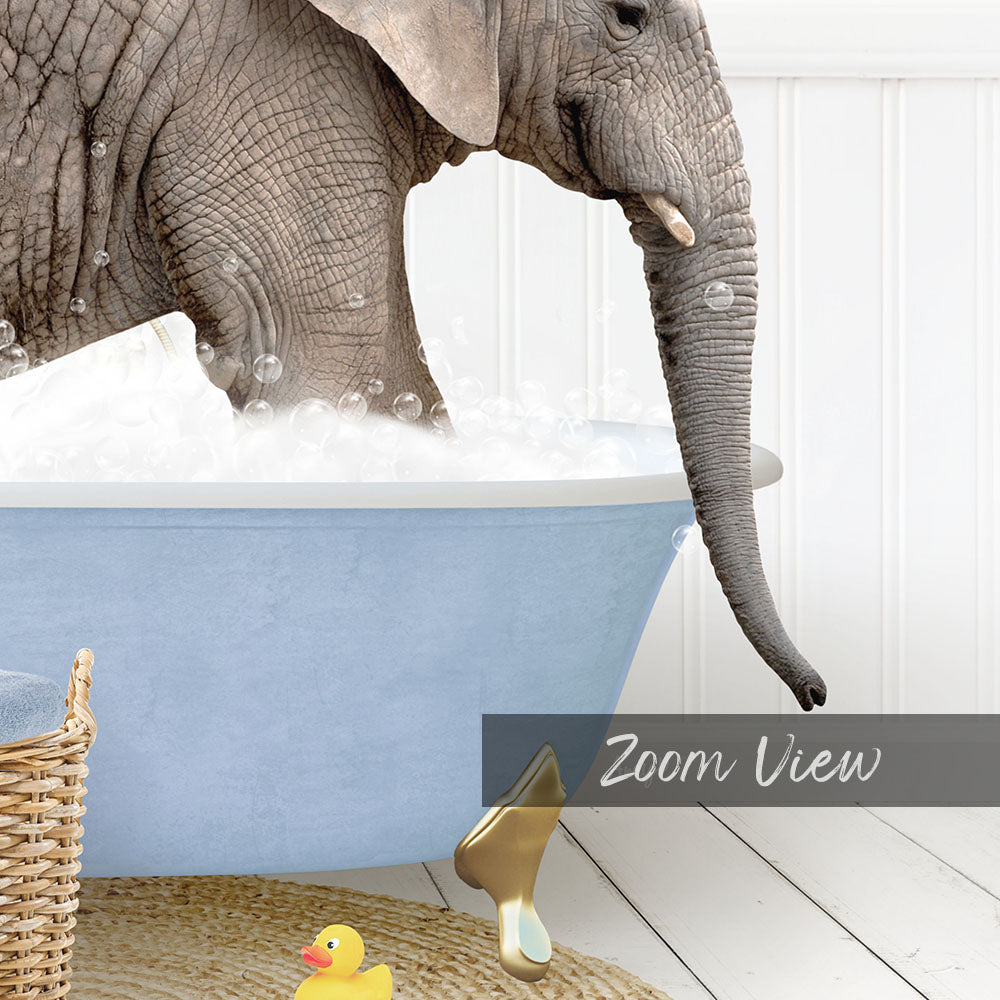 A large elephant is taking a bath in a blue tub, surrounded by rubber ducks and a basket.