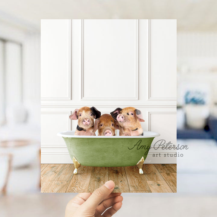 a person holding up a card with three dogs in a bathtub