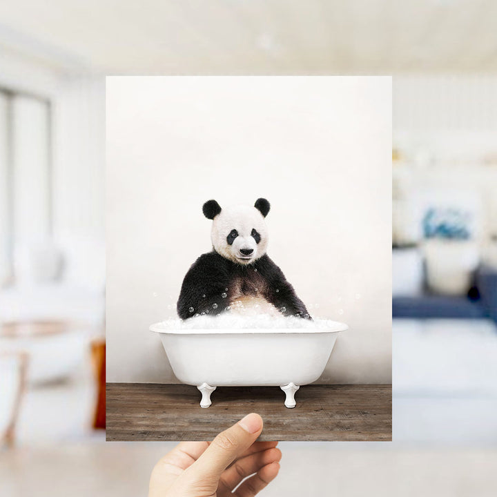 A panda bear sitting in a white bathtub filled with bubbles, as if enjoying a relaxing bath.