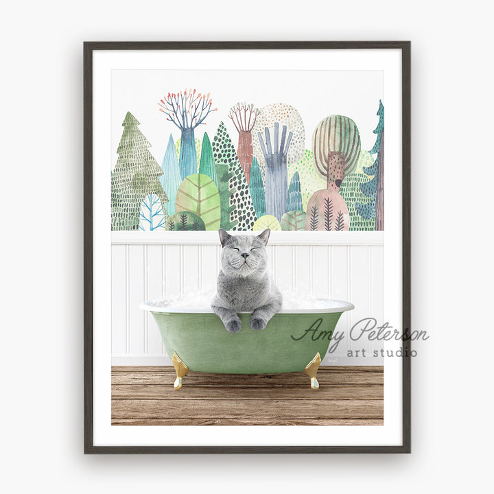 a gray cat sitting in a green bath tub