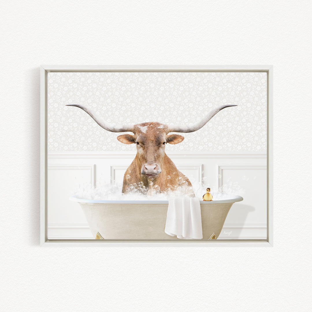 A bull with large horns is sitting in a bathtub filled with bubbles, appearing to enjoy the bath.