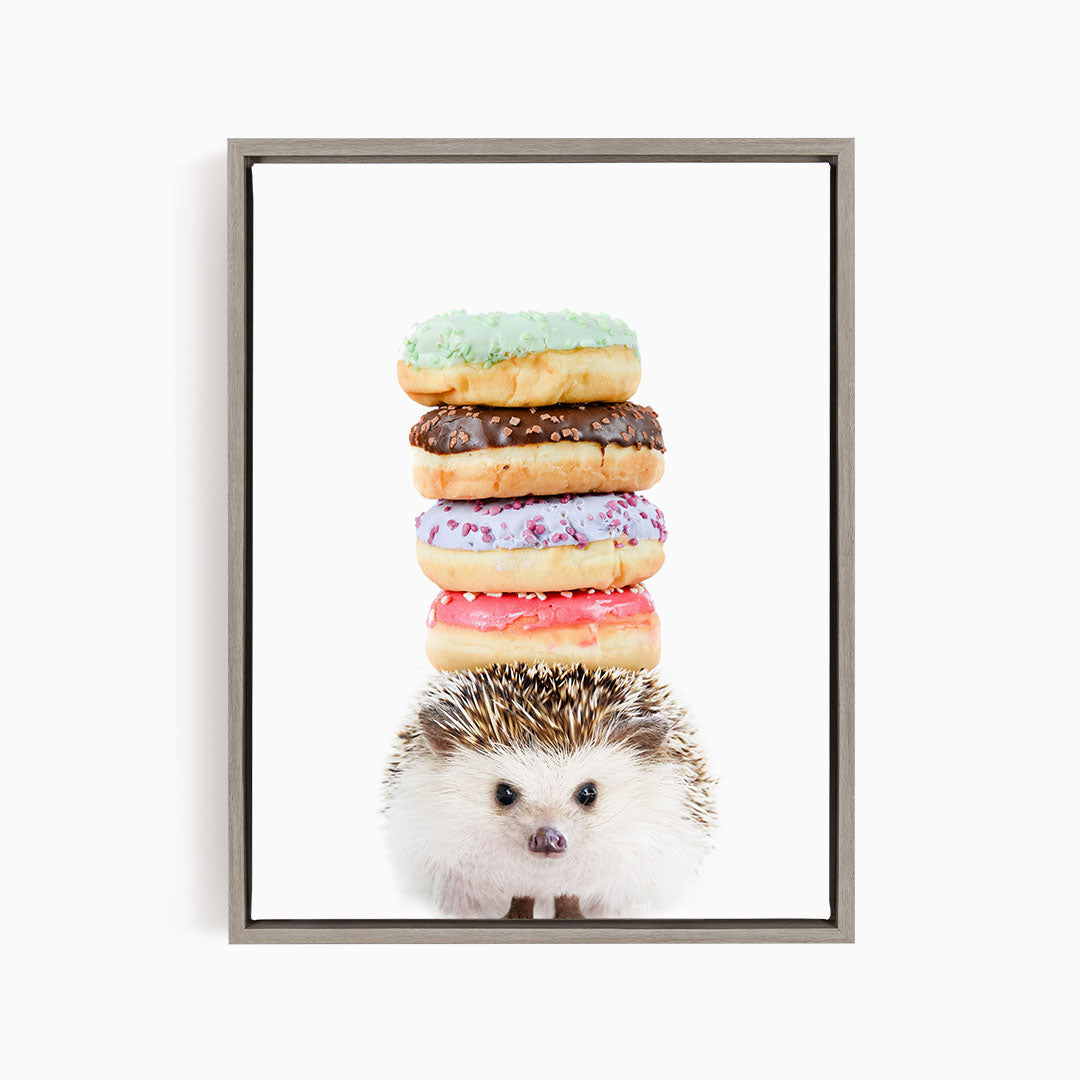 A hedgehog is standing in front of a stack of colorful donuts, with the donuts piled on top of the hedgehog.