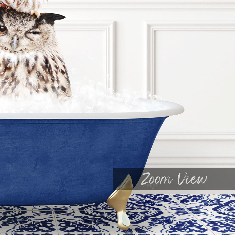 A close-up of an owl sitting in a blue bathtub filled with bubbles, with a white wall and a patterned tile floor in the background.