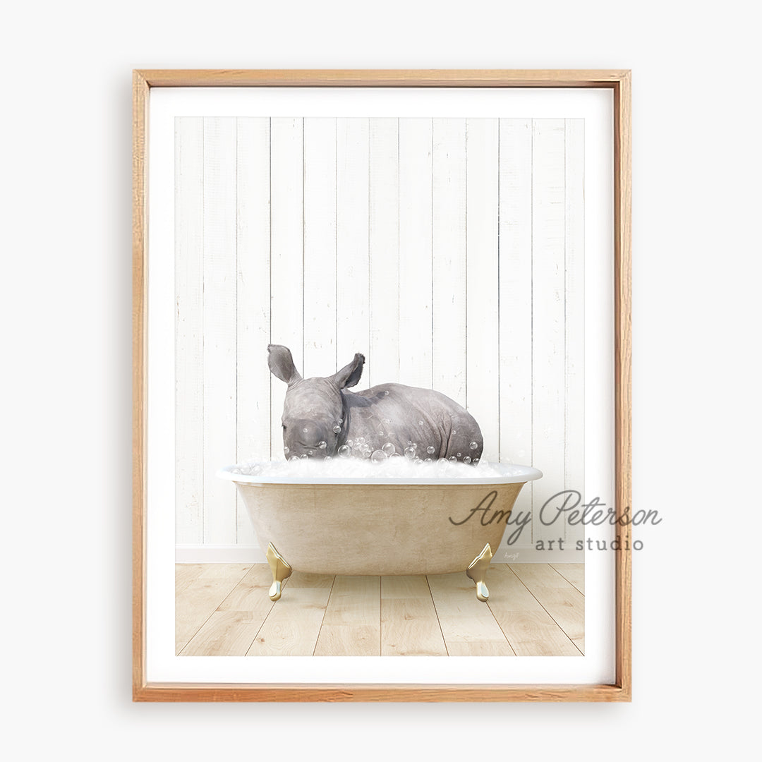 a rhino laying in a bathtub with a wooden frame