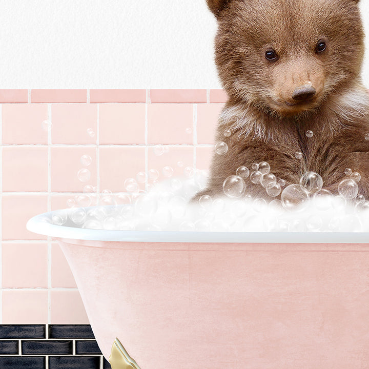 a brown bear sitting in a bath tub filled with bubbles