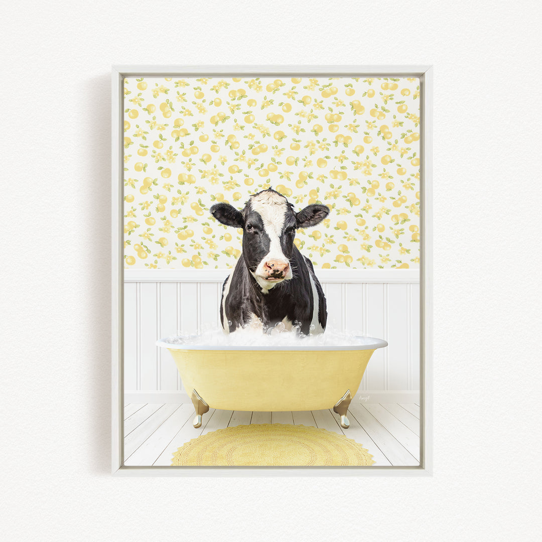 A black and white cow is sitting in a yellow bathtub filled with water, surrounded by a yellow floral pattern on the wall behind it.