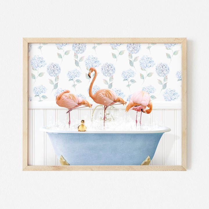 three flamingos are standing in a bathtub with bubbles