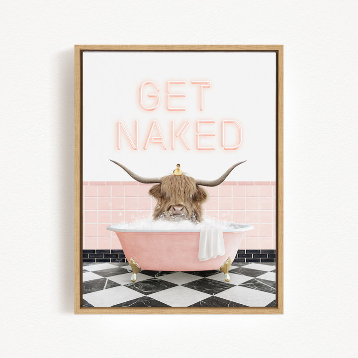 A framed image depicting a horned animal, possibly a yak or a cow, sitting in a pink bathtub filled with bubbles, with the text "GET NAKED" displayed above it.