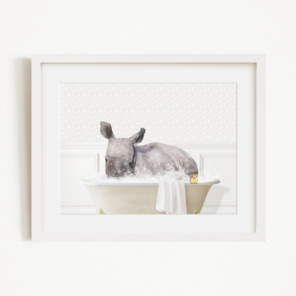 A rhinoceros is sitting in a bathtub filled with water, surrounded by bubbles.