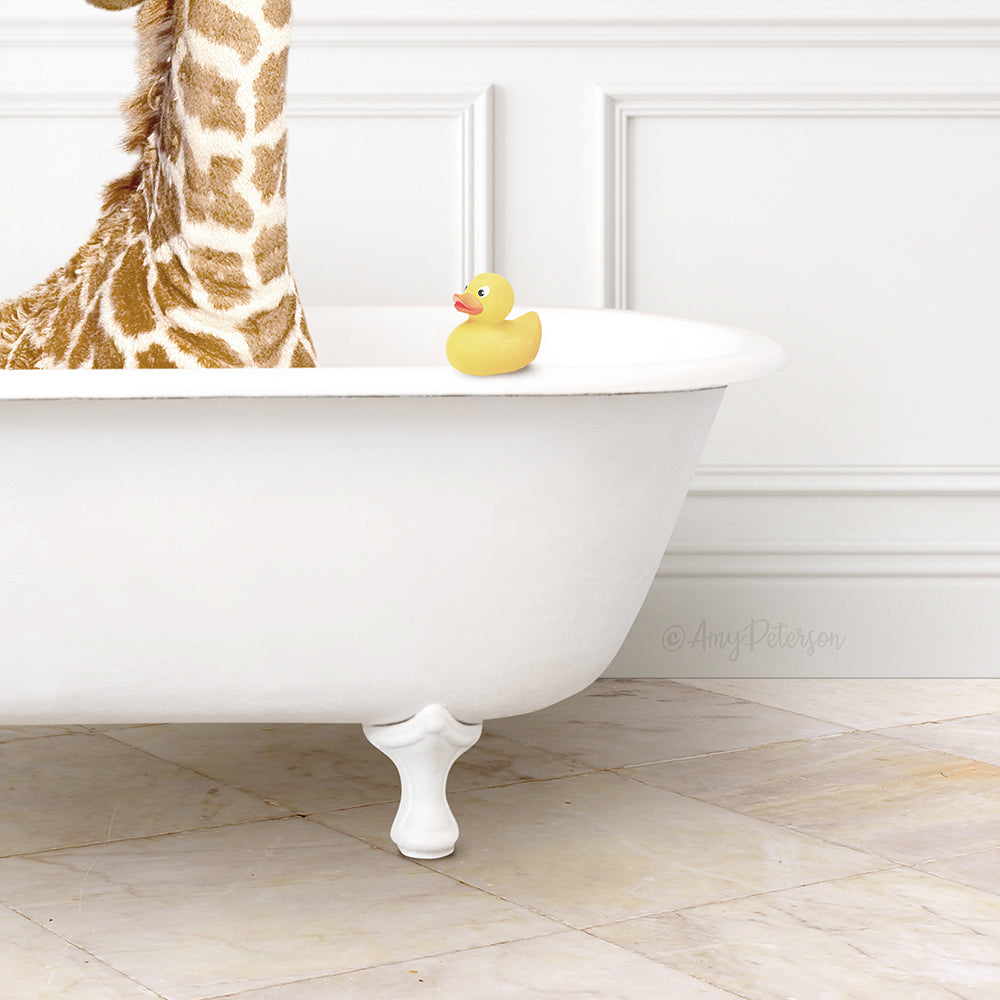 A giraffe stands in a white bathtub, with a yellow rubber duck floating on the water.