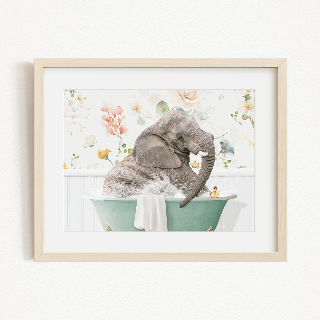 A gray elephant is sitting in a green bathtub filled with water, surrounded by flowers and other decorative elements.