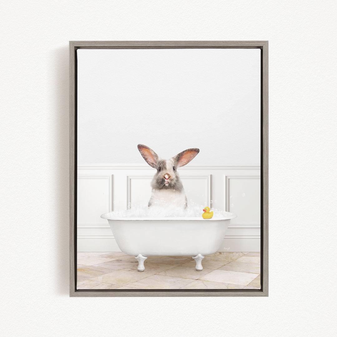 A white rabbit sitting in a white bathtub filled with bubbles, with a rubber duck floating in the water.