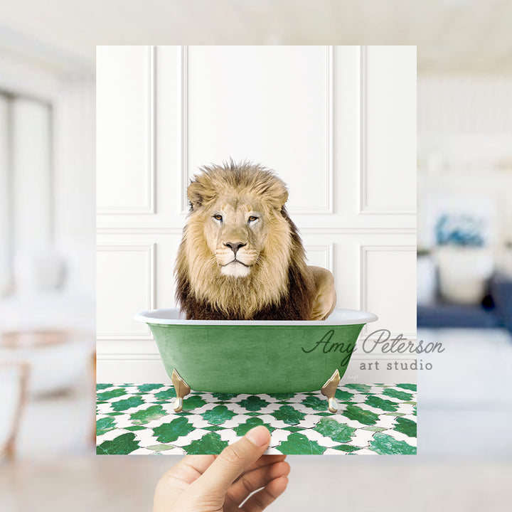 a hand holding a card with a picture of a lion in a bathtub