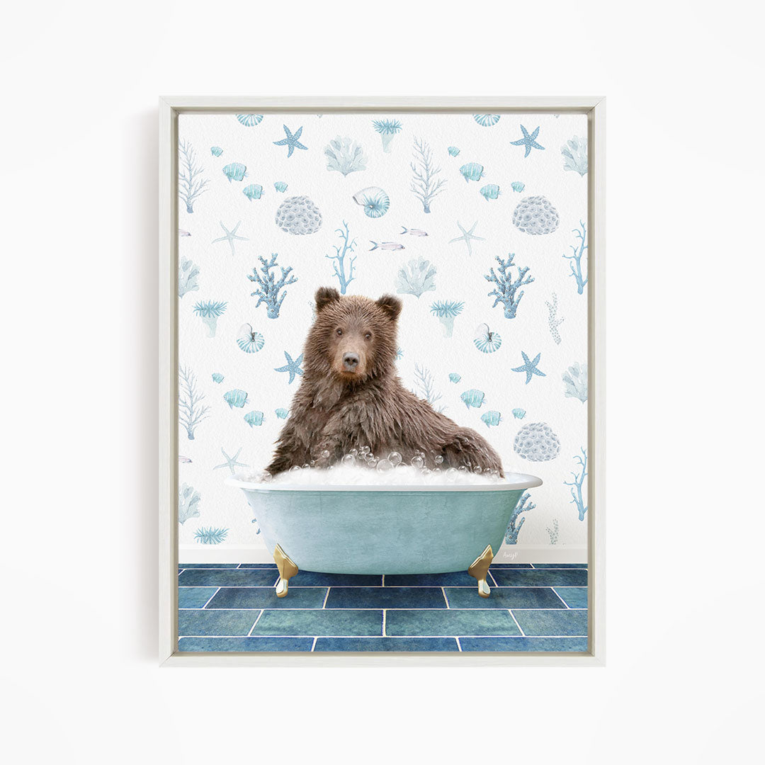 A brown bear sitting in a blue bathtub filled with bubbles, surrounded by a pattern of seashells, starfish, and other marine life.