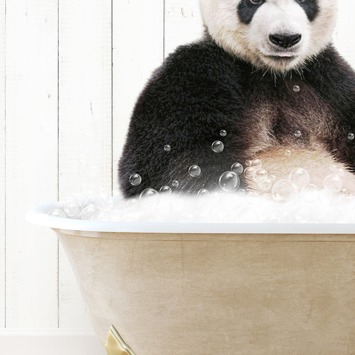 a panda bear sitting in a bathtub full of bubbles