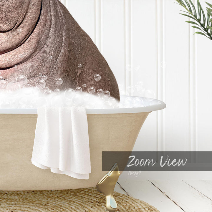 A bathtub filled with bubbles, with a towel hanging on the side and a gold-colored object next to it.