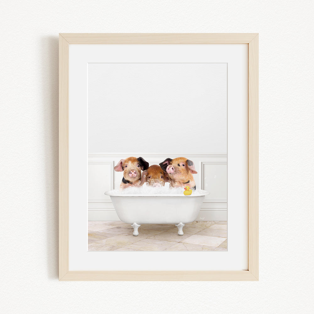 Three adorable pigs sitting in a white bathtub, enjoying a relaxing bath.