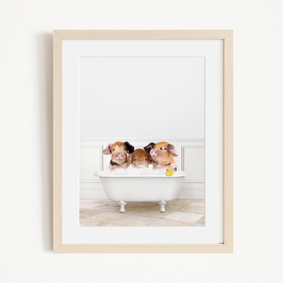Three adorable pigs sitting in a white bathtub, enjoying a relaxing bath.
